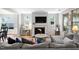 Bright living room boasts a fireplace, TV, and plenty of natural light at 1458 Wragby Ln, Apex, NC 27502