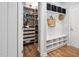 Mud room with closet and bench storage and adjacent pantry at 1458 Wragby Ln, Apex, NC 27502