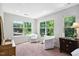 Comfortable sitting area with natural light and two chairs at 1458 Wragby Ln, Apex, NC 27502