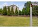 Beautiful, well-maintained community soccer field surrounded by mature trees and landscaping at 1458 Wragby Ln, Apex, NC 27502