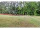 Expansive backyard featuring mature trees, offering privacy and a natural setting at 1512 Arapahoe Ridge Dr, Raleigh, NC 27604