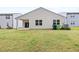 A spacious backyard with a well-maintained lawn and a covered patio, perfect for outdoor entertaining at 1512 Arapahoe Ridge Dr, Raleigh, NC 27604