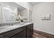 This bathroom features a dual sink vanity with granite counter and mirror at 1512 Arapahoe Ridge Dr, Raleigh, NC 27604