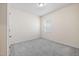 Bedroom with neutral walls and plush carpet, complemented by natural light at 1512 Arapahoe Ridge Dr, Raleigh, NC 27604