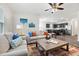 Open concept living room featuring hardwood floors and view into the kitchen with stainless steel appliances at 1512 Arapahoe Ridge Dr, Raleigh, NC 27604