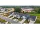 New homes feature attractive exteriors and landscaping, situated in a community surrounded by trees and ongoing construction at 159 Wood Orchid Ln, Garner, NC 27529