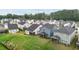 Aerial view of a neighborhood showcasing well-maintained lawns and inviting screened-in porches at 159 Wood Orchid Ln, Garner, NC 27529