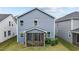 Home with a screened-in porch overlooking a lush backyard, perfect for outdoor entertaining and relaxation at 159 Wood Orchid Ln, Garner, NC 27529