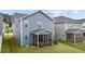 Home with a screened-in porch offering serene backyard views, perfect for enjoying the outdoors at 159 Wood Orchid Ln, Garner, NC 27529