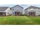 The backyard features a cozy screened-in porch perfect for relaxing and enjoying the outdoors at 159 Wood Orchid Ln, Garner, NC 27529