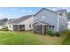 Relaxing screened-in porch of a home with a serene backyard, perfect for entertaining and unwinding at 159 Wood Orchid Ln, Garner, NC 27529
