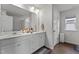 Bright bathroom with double sinks, white cabinetry, and elegant fixtures for a modern, clean look at 159 Wood Orchid Ln, Garner, NC 27529