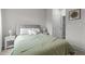 Comfortable bedroom featuring a queen bed, side tables, and access to the bathroom at 159 Wood Orchid Ln, Garner, NC 27529