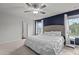 Bright bedroom featuring neutral tones, a large window, and a comfortable king-sized bed at 159 Wood Orchid Ln, Garner, NC 27529