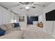 Cozy bonus room featuring a comfortable sofa and views of the upper stair landing at 159 Wood Orchid Ln, Garner, NC 27529