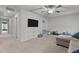 Well-lit bonus room offers flexible space for recreation, complete with TV and storage at 159 Wood Orchid Ln, Garner, NC 27529