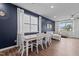 Bright dining area featuring a stylish table set, modern light fixtures, and a large window at 159 Wood Orchid Ln, Garner, NC 27529