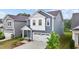 Attractive two-story home with blue siding, a two-car garage, and a well-maintained front yard at 159 Wood Orchid Ln, Garner, NC 27529