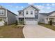 Charming two-story home with a well-manicured lawn, two car garage, and inviting curb appeal at 159 Wood Orchid Ln, Garner, NC 27529