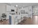 Bright, spacious kitchen with white cabinets, a center island, and stainless steel appliances at 159 Wood Orchid Ln, Garner, NC 27529