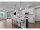 Bright, open kitchen featuring a large island with seating and modern appliances at 159 Wood Orchid Ln, Garner, NC 27529
