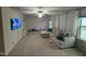 Large living room with plush sectional sofa, ample space, and plenty of natural light at 159 Wood Orchid Ln, Garner, NC 27529