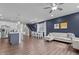 Open-concept living room boasts hardwood floors, modern furnishings, and ample natural light at 159 Wood Orchid Ln, Garner, NC 27529