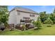 Lush backyard featuring a stone fire pit and a multi-level deck with shaded seating at 19 Arch Oak Ct, Clayton, NC 27527