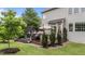 Spacious wooden deck with an outdoor dining area and seating under a shade canopy at 19 Arch Oak Ct, Clayton, NC 27527