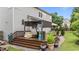 Outdoor deck featuring shaded seating and a dining area, perfect for relaxing and entertaining at 19 Arch Oak Ct, Clayton, NC 27527