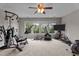 Spacious carpeted home gym with fitness equipment and natural light at 19 Arch Oak Ct, Clayton, NC 27527
