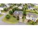 Aerial view of a two-story brick home with a well manicured yard and a two car garage at 19 Arch Oak Ct, Clayton, NC 27527