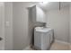 This utility room has bright white cabinets above a modern washer and dryer set at 19 Arch Oak Ct, Clayton, NC 27527