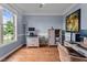 Office featuring hardwood floors, natural light, and custom desk at 19 Arch Oak Ct, Clayton, NC 27527
