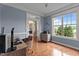 Bright office with hardwood floors, large window, and view of front yard at 19 Arch Oak Ct, Clayton, NC 27527