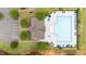 Aerial view of a community pool, clubhouse, pool furniture and parking area at 19 Arch Oak Ct, Clayton, NC 27527
