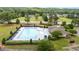 Aerial view of a community pool with several lounge chairs and umbrellas at 19 Arch Oak Ct, Clayton, NC 27527