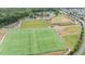 Overhead capture of sports fields: a baseball diamond, multiple soccer fields, parking, and green spaces at 19 Arch Oak Ct, Clayton, NC 27527