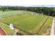 Overhead view of a well-maintained green soccer field, complete with goals and neatly trimmed grass, for sports activities at 19 Arch Oak Ct, Clayton, NC 27527