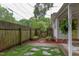 Cozy backyard featuring a garden, wooden fence, and stone pathway at 1915 James St, Durham, NC 27707