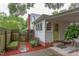 Quaint backyard with garden boxes, wooden fence and covered side entrance at 1915 James St, Durham, NC 27707