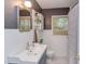 Updated bathroom with white subway tile, updated vanity, and contrasting paint at 1915 James St, Durham, NC 27707