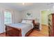 Cozy bedroom featuring hardwood floors, natural light, and neutral paint at 1915 James St, Durham, NC 27707