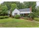 Exterior front view featuring a well-manicured lawn and charming landscaping at 1915 James St, Durham, NC 27707