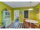 Bright eat-in kitchen featuring checkered floors and modern table with wood chairs at 1915 James St, Durham, NC 27707