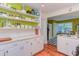 Open kitchen design featuring white cabinets, open shelving and light countertops at 1915 James St, Durham, NC 27707