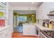 Eat in kitchen with stainless appliances, white cabinets, and hardwood floors at 1915 James St, Durham, NC 27707