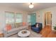 Bright living room with lots of natural light, hardwood floors, and neutral paint at 1915 James St, Durham, NC 27707