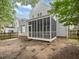 Exterior view of home featuring screened in porch and fenced yard at 1928 Shadow Glen Dr, Raleigh, NC 27604