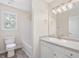 Bathroom features a vanity with sink and a shower and tub combo at 1928 Shadow Glen Dr, Raleigh, NC 27604